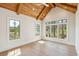 Vaulted bedroom featuring wood ceiling beams and expansive windows at 105 Peninsula Dr, Ravenel, SC 29470