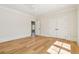 Spacious bedroom with hardwood floors, large closet, ceiling fan and natural light from a window at 105 Peninsula Dr, Ravenel, SC 29470