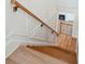 Elegant staircase with decorative trim leading to the lower level of the home at 105 Peninsula Dr, Ravenel, SC 29470