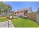 Spacious backyard with a well-maintained lawn, patio area, and privacy fence at 106 Nottingham Ct, Summerville, SC 29485