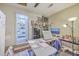 Functional craft room featuring a work table and an organized shelving unit with supplies, ideal for creative projects at 106 Nottingham Ct, Summerville, SC 29485