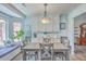 Bright dining area with bay window seating, custom millwork, and adjacent kitchen at 106 Nottingham Ct, Summerville, SC 29485