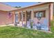 Charming front porch with rocking chairs and flower-filled planters, creating a welcoming and inviting entryway at 106 Nottingham Ct, Summerville, SC 29485