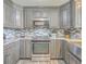 Upgraded kitchen with stainless appliances, granite counters, subway tile, and custom cabinets at 106 Nottingham Ct, Summerville, SC 29485