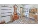 Traditional living room showcases a grandfather clock, hardwood floors, and shelving, creating a warm and inviting atmosphere at 106 Nottingham Ct, Summerville, SC 29485