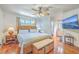 Cozy bedroom featuring wood floors, a ceiling fan and en suite bathroom at 106 Nottingham Ct, Summerville, SC 29485