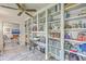 Bright office featuring built-in shelves, plenty of storage, natural light, and a ceiling fan, promoting a productive workspace at 106 Nottingham Ct, Summerville, SC 29485