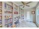 Bright office space with built-in shelving, ceiling fan, and natural light at 106 Nottingham Ct, Summerville, SC 29485