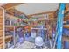 Organized shed with shelving, tools, and storage, providing ample space for gardening and maintenance equipment at 106 Nottingham Ct, Summerville, SC 29485