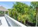 Upper balcony showcasing views of swaying palms and lush greenery, inviting relaxation at 11 49Th Ave, Isle of Palms, SC 29451