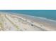 White sand beach with blue umbrellas and ocean views at 11 49Th Ave, Isle of Palms, SC 29451