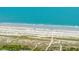 Aerial view of a pristine beach with turquoise water and white sand at 11 49Th Ave, Isle of Palms, SC 29451