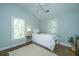 Cozy bedroom with natural light, hardwood floors, and a tranquil, airy feel at 11 49Th Ave, Isle of Palms, SC 29451