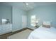 Charming bedroom with hardwood floors, natural light, and a calming, airy atmosphere at 11 49Th Ave, Isle of Palms, SC 29451