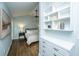 Stylish bedroom with hardwood floors, custom shelves, and a serene, airy feel at 11 49Th Ave, Isle of Palms, SC 29451