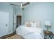 Calm bedroom with ceiling fan, carpet, and natural light perfect for relaxation at 11 49Th Ave, Isle of Palms, SC 29451