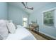 Bright bedroom with outdoor access, desk, and natural light at 11 49Th Ave, Isle of Palms, SC 29451