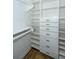 Walk-in closet with custom built-in shelving and drawers offers ample storage space at 11 49Th Ave, Isle of Palms, SC 29451
