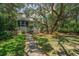 Charming home with a lush garden, screened porch and inviting walkway at 11 49Th Ave, Isle of Palms, SC 29451