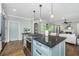 Open concept kitchen with stainless steel appliances, center island, and hardwood floors at 11 49Th Ave, Isle of Palms, SC 29451