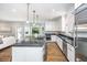 Modern kitchen with large island, stainless steel appliances, and open layout offers great flow and functionality at 11 49Th Ave, Isle of Palms, SC 29451