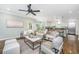 Open-concept living room with hardwood floors, fireplace, and view of the kitchen and breakfast nook at 11 49Th Ave, Isle of Palms, SC 29451