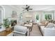 Bright living room with a fireplace, hardwood floors, and lots of comfortable seating at 11 49Th Ave, Isle of Palms, SC 29451