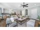 Spacious living room with fireplace, hardwood floors, and connection to kitchen and dining at 11 49Th Ave, Isle of Palms, SC 29451