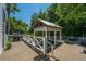Deck features covered pool, grill, and ample space for entertaining and outdoor living at 11 49Th Ave, Isle of Palms, SC 29451
