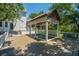 A private plunge pool is built into the deck of this charming grey home at 11 49Th Ave, Isle of Palms, SC 29451