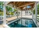 A covered plunge pool is the centerpiece of this home's wooden deck at 11 49Th Ave, Isle of Palms, SC 29451