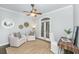 Comfortable sitting room features stylish armchairs, a work desk, and access to the outdoor patio via French doors at 11 49Th Ave, Isle of Palms, SC 29451