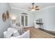 Cozy sitting room with plush armchairs, stylish decor, and French doors to the outdoors offers a serene retreat at 11 49Th Ave, Isle of Palms, SC 29451