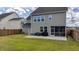 Fenced backyard with a covered patio, showcasing an ideal space for outdoor relaxation at 1115 Fitzgerald Ct, Summerville, SC 29485
