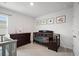 Neutral-toned Bedroom with a dark wood crib, dresser, and framed pictures adorning the walls at 1115 Fitzgerald Ct, Summerville, SC 29485