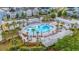 Beautiful community pool surrounded by palm trees, seating areas, and well-maintained landscaping at 1115 Fitzgerald Ct, Summerville, SC 29485