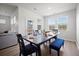 Bright dining room features wood floors, bench seating, and a view of the landscaped yard at 1115 Fitzgerald Ct, Summerville, SC 29485