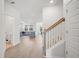 Open entryway shows the flow between the home's living room, staircase, and guest bathroom at 1115 Fitzgerald Ct, Summerville, SC 29485