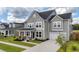 Attractive two-story home with a covered porch, attached garage, and a well-maintained front lawn at 1115 Fitzgerald Ct, Summerville, SC 29485