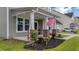 Charming home featuring an inviting front porch with brick columns and lush landscaping at 1115 Fitzgerald Ct, Summerville, SC 29485