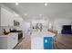 Spacious open-concept kitchen with large island, white cabinets, stainless appliances, and hardwood floors at 1115 Fitzgerald Ct, Summerville, SC 29485