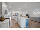 Bright open-concept kitchen with large island, stainless appliances, and seamless flow to the living area at 1115 Fitzgerald Ct, Summerville, SC 29485