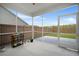 Covered screened-in porch featuring a backyard view with a privacy fence, inviting relaxation at 1115 Fitzgerald Ct, Summerville, SC 29485