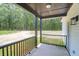 Enjoy the covered back porch with a view of the treeline at 112 Southsong Ln, Goose Creek, SC 29445