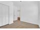 Neutral carpeted bedroom featuring a closet, white trim, and ample natural light at 112 Southsong Ln, Goose Creek, SC 29445