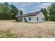 Newly constructed home featuring white siding, a black roof, and a charming covered front porch at 112 Southsong Ln, Goose Creek, SC 29445
