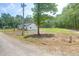 Newly built home with a bright exterior nestled among mature trees and a spacious yard at 112 Southsong Ln, Goose Creek, SC 29445