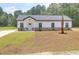 A charming home with a well-manicured lawn and a stylish modern design at 112 Southsong Ln, Goose Creek, SC 29445