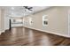 Open-concept living space showcases new flooring, multiple windows, and seamless flow into the kitchen area, great for entertaining at 112 Southsong Ln, Goose Creek, SC 29445