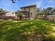 Expansive backyard featuring a covered porch and a lush green lawn at 120 Apache Dr, Summerville, SC 29483